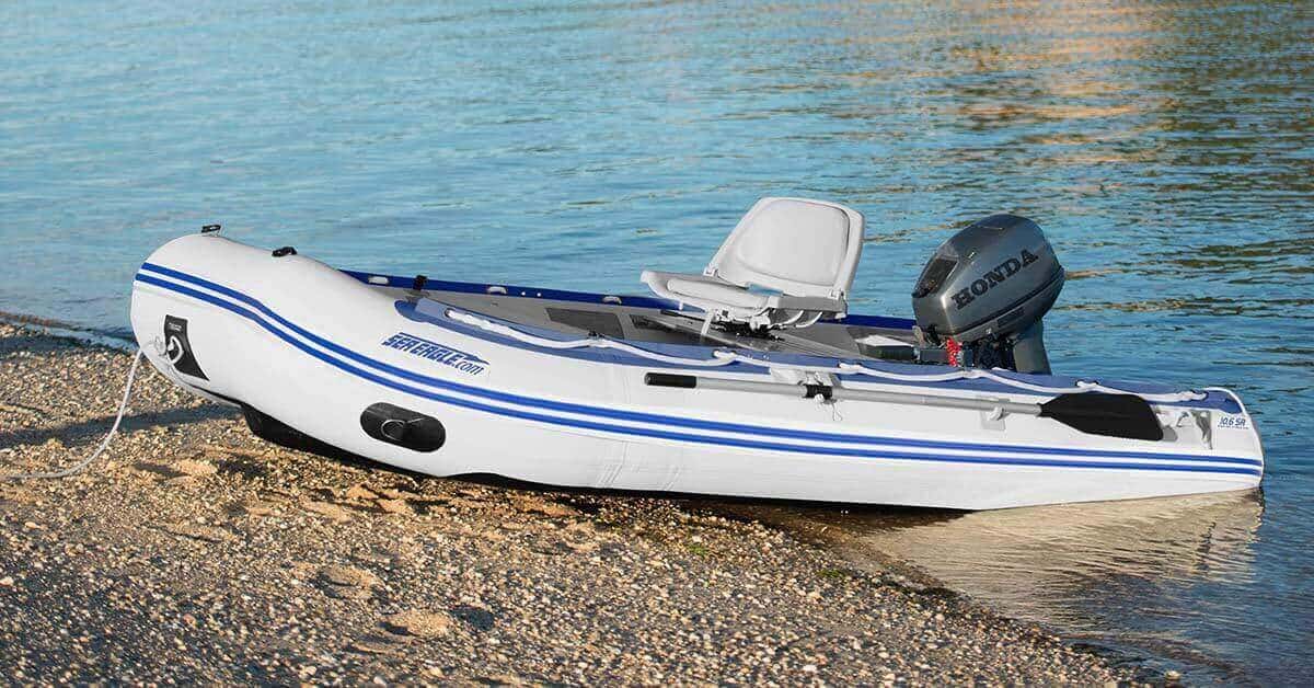 A Sea Eagle 10’6″ Sport Runabout Inflatable Boat moored at the shoreline.