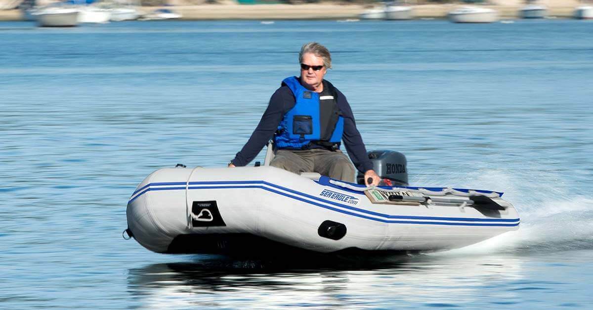 A Sea Eagle 10’6″ Sport Runabout Inflatable Boat racing at top speed.