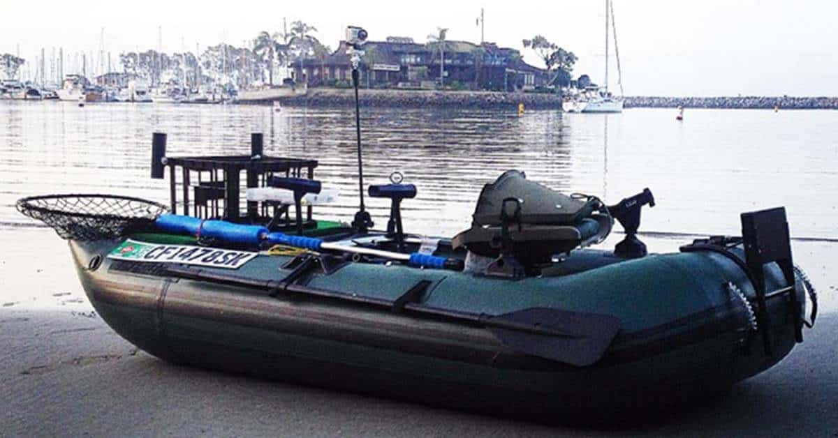 A customized Sea Eagle 285 Frameless Pontoon Boat Inflatable Fishing Boat sitting on the shoreline.