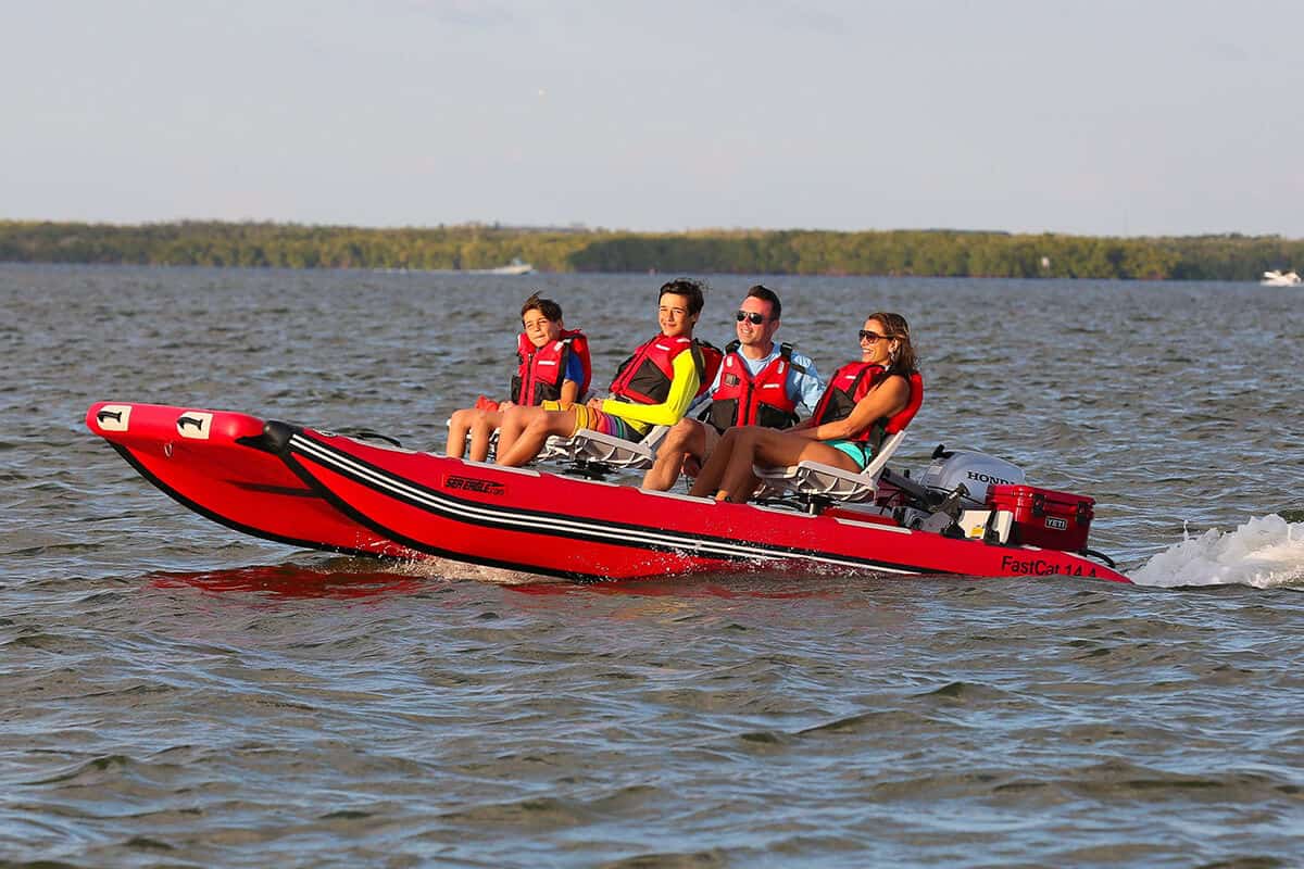 The Sea Eagle FastCat14 Catamaran Inflatable Boat can reach speed of 23 mph with a 20 hp outboard motor.