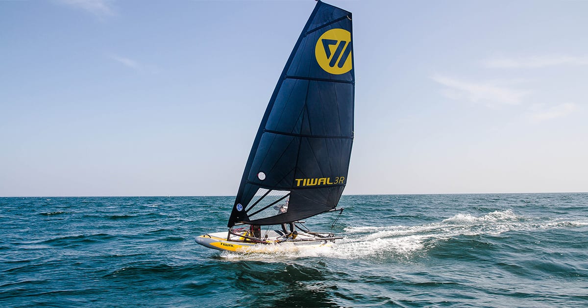 Tiwal inflatable sailboat sailing on the ocean.