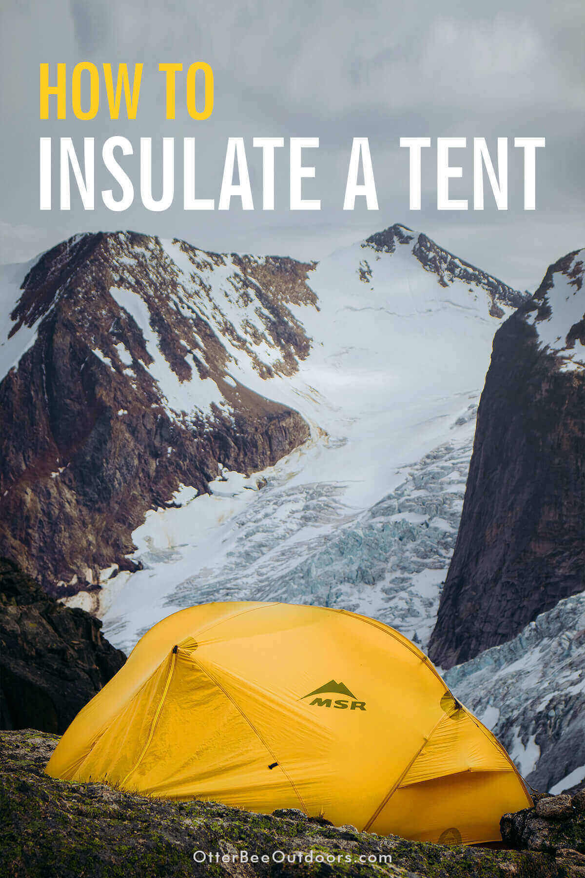 A yellow, MSR 4-season insulated tent set up in the mountains during winter.