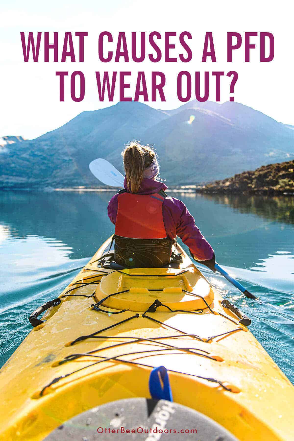 A woman wearing a PFD paddling in the front of a tandem kayak on a beautiful lake at the base of a mountain range. The graphic asks, "What Causes a PFD to Wear Out?"