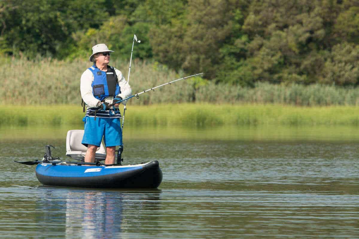 A man stands and fishes from an Explorer 300x.