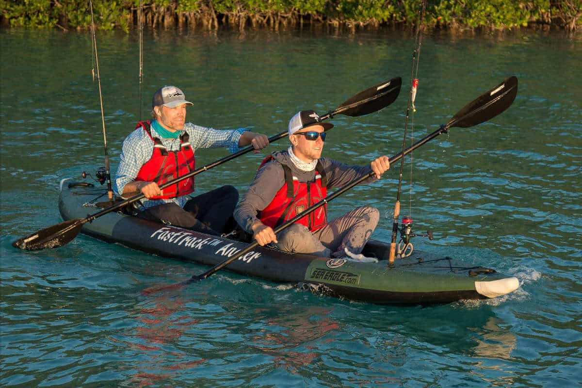 Two fishermen tandem paddle a FastTrack 385fta.