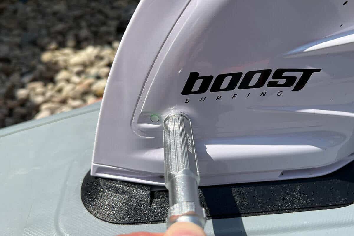 The magnetic back of the installation screwdriver is used to turn on the Boost Fin. Notice the faint green light.